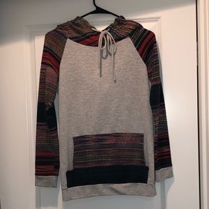 Gray sweatshirt with multicolored stripes on the arms, pocket, and hood